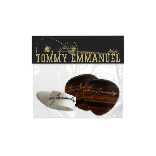 Packaged guitar picks with Tommy Emmanuel branding.