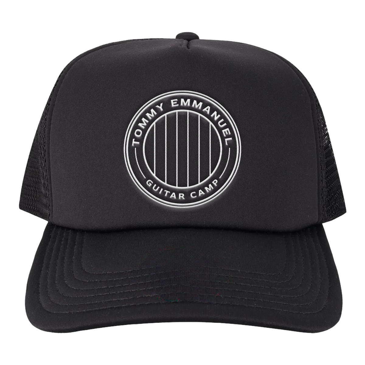A black trucker hat with a white circular embroidered logo on the front that reads 'TOMMY EMMANUEL GUITAR CAMP'. The hat features a structured black front panel, a curved black brim, and black mesh back panels, shown against a plain white background.
